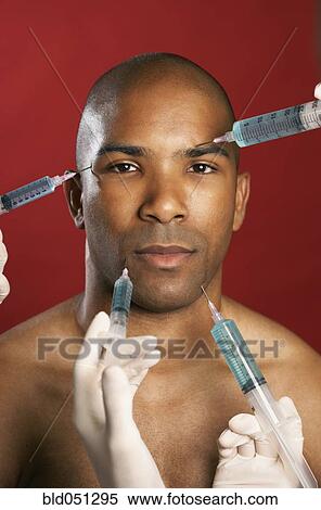 African American man receiving injections in face View Large Photo Image Stock Photography - African American man receiving injections in face. Fotosearch