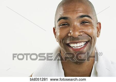 Stock Image - African American man with towel around neck. Fotosearch