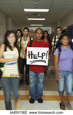 African American teenaged student holding Help sign View Large Photo Image Stock Image - African American teenaged student holding Help sign. Fotosearch