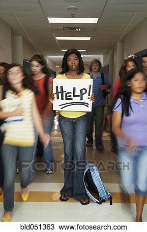 African American teenaged student holding Help sign View Large Photo Image Stock Image - African American teenaged student holding Help sign. Fotosearch