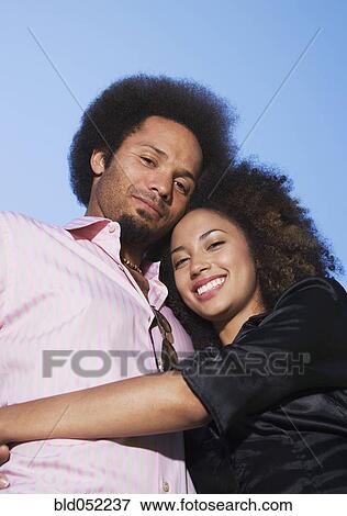 Stock Photo - African couple hugging. Fotosearch