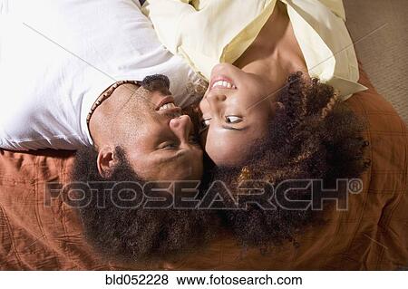 African couple smiling at each other View Large Photo Image Stock Photo - African couple smiling at each other. Fotosearch
