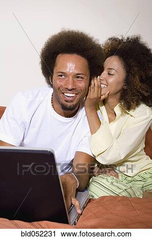 African couple telling secret View Large Photo Image Stock Image - African couple telling secret. Fotosearch