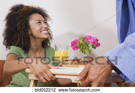 African man bringing breakfast in bed to wife View Large Photo Image Stock Image - African man bringing breakfast in bed to wife. Fotosearch