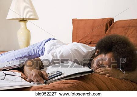 African man sleeping on bed View Large Photo Image Stock Photo - African man sleeping on bed. Fotosearch