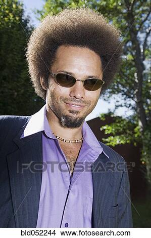 Picture - African man wearing sunglasses. Fotosearch