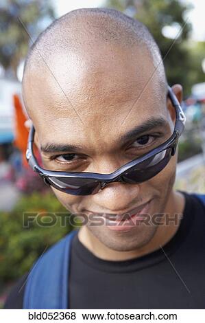 Stock Photo - African man wearing sunglasses. Fotosearch