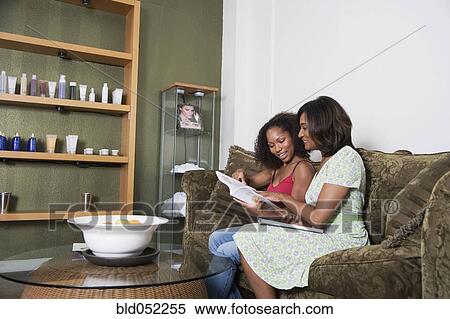 African mother and adult daughter in hair salon View Large Photo Image Stock Photography - African mother and adult daughter in hair salon. Fotosearch