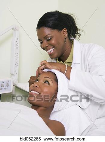 African woman receiving spa facial treatment View Large Photo Image Stock Photography - African woman receiving spa facial treatment. Fotosearch