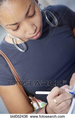 African woman writing View Large Photo Image Stock Photograph - African woman writing. Fotosearch