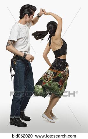 Stock Image - Asian couple dancing. Fotosearch