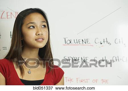 Stock Photo - Asian teenaged girl in science class. Fotosearch