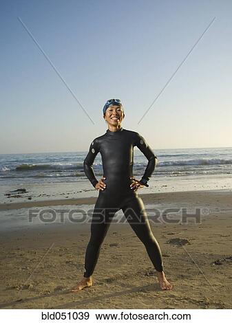 Asian woman wearing wetsuit and goggles View Large Photo Image Stock Photo - Asian woman wearing wetsuit and goggles. Fotosearch