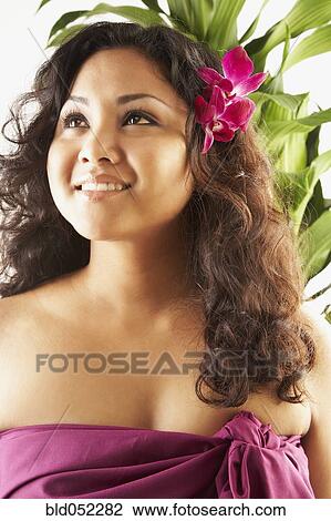 Stock Photo of Pacific Islander woman with flower in hair bld052282 ...