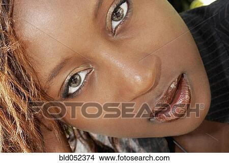 Picture - Close up of young African woman. Fotosearch