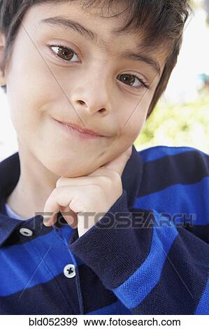 Stock Photo - Hispanic boy making a face. Fotosearch