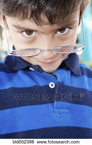 Hispanic boy wearing eyeglasses View Large Photo Image Stock Photo - Hispanic boy wearing eyeglasses. Fotosearch