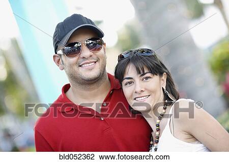 Stock Image - Hispanic couple hugging. Fotosearch