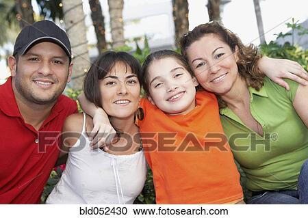 Stock Image - Hispanic family hugging. Fotosearch