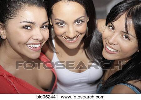 Hispanic friends hugging View Large Photo Image Stock Image - Hispanic friends hugging. Fotosearch
