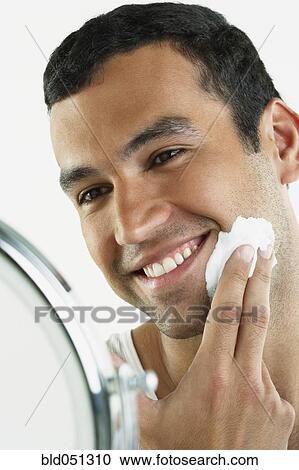 Hispanic man applying shaving cream View Large Photo Image Stock Image - Hispanic man applying shaving cream. Fotosearch