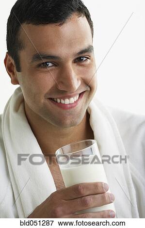 Hispanic man drinking milk View Large Photo Image Stock Photo - Hispanic man drinking milk. Fotosearch