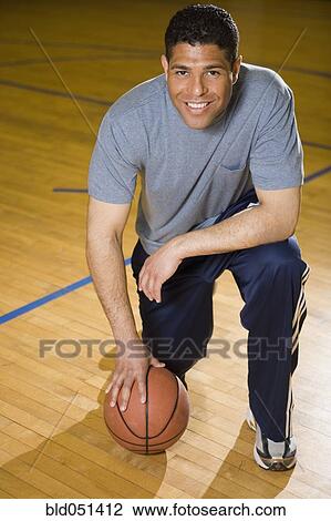 Hispanic man holding basketball View Large Photo Image Stock Image - Hispanic man holding basketball. Fotosearch