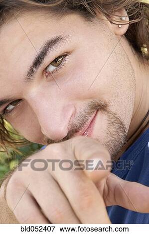 Stock Photo - Hispanic man pointing. Fotosearch