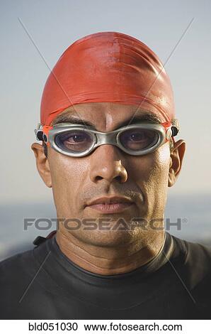 Hispanic man wearing wetsuit and goggles View Large Photo Image Stock Image - Hispanic man wearing wetsuit and goggles. Fotosearch