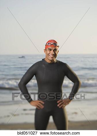 Hispanic man wearing wetsuit and goggles View Large Photo Image Stock Photo - Hispanic man wearing wetsuit and goggles. Fotosearch