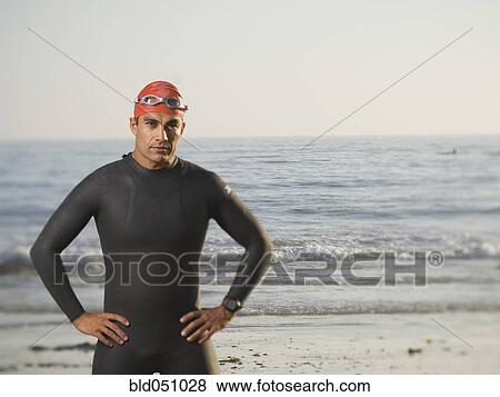 Hispanic man wearing wetsuit and goggles View Large Photo Image Stock Photo - Hispanic man wearing wetsuit and goggles. Fotosearch