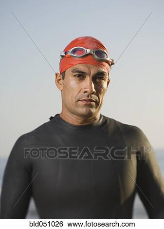 Hispanic man wearing wetsuit and goggles View Large Photo Image Stock Photograph - Hispanic man wearing wetsuit and goggles. Fotosearch