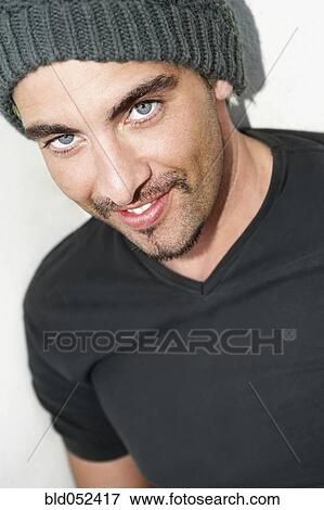Stock Photo - Hispanic man wearing wool hat. Fotosearch
