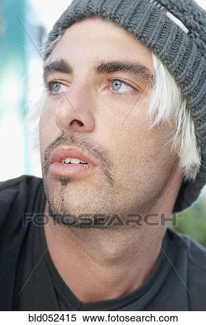 Stock Photography - Hispanic man wearing wool hat. Fotosearch