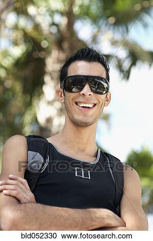 Hispanic man with arms crossed View Large Photo Image Stock Image - Hispanic man with arms crossed. Fotosearch