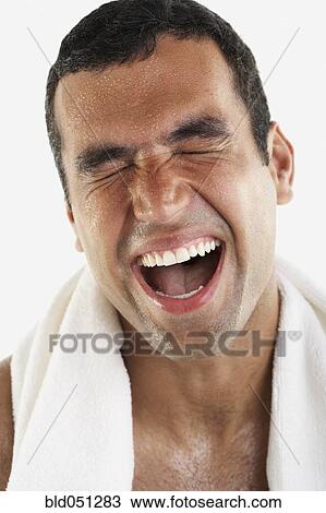 Stock Image - Hispanic man yawning. Fotosearch