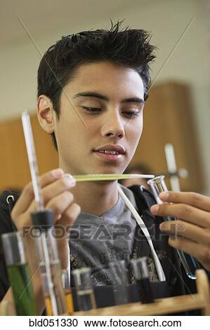 Hispanic teenaged boy in science class View Large Photo Image Stock Image - Hispanic teenaged boy in science class. Fotosearch