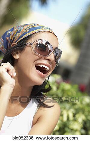 Stock Photograph - Hispanic woman laughing. Fotosearch