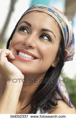 Stock Photo - Hispanic woman looking up. Fotosearch