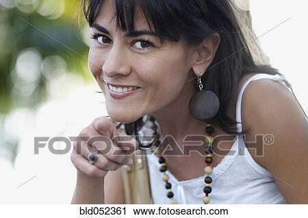 Hispanic woman pointing View Large Photo Image Stock Image - Hispanic woman pointing. Fotosearch