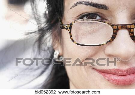 Hispanic woman wearing eyeglasses View Large Photo Image Stock Image - Hispanic woman wearing eyeglasses. Fotosearch