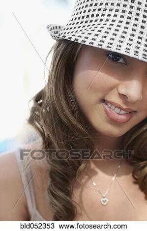 Hispanic woman wearing hat View Large Photo Image Stock Image - Hispanic woman wearing hat. Fotosearch