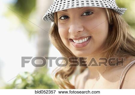 Hispanic woman wearing hat View Large Photo Image Stock Photo - Hispanic woman wearing hat. Fotosearch