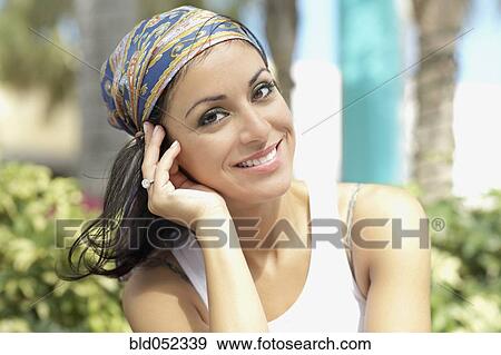 Stock Photo - Hispanic woman wearing scarf on head. Fotosearch