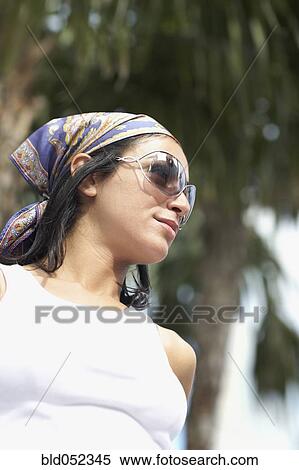 Hispanic woman wearing sunglasses View Large Photo Image Stock Photography - Hispanic woman wearing sunglasses. Fotosearch