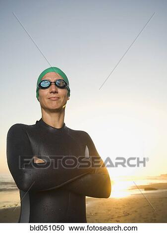 Hispanic woman wearing wetsuit and goggles View Large Photo Image Stock Image - Hispanic woman wearing wetsuit and goggles. Fotosearch