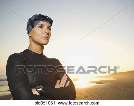 Hispanic woman wearing wetsuit and goggles View Large Photo Image Stock Image - Hispanic woman wearing wetsuit and goggles. Fotosearch
