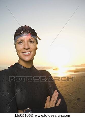 Hispanic woman wearing wetsuit and goggles View Large Photo Image Stock Image - Hispanic woman wearing wetsuit and goggles. Fotosearch
