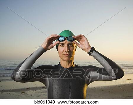 Hispanic woman wearing wetsuit and goggles View Large Photo Image Stock Photo - Hispanic woman wearing wetsuit and goggles. Fotosearch