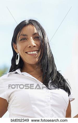 Low angle view of Hispanic woman View Large Photo Image Stock Photo - Low angle view of Hispanic woman. Fotosearch